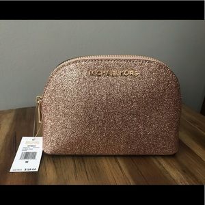Michael kors large rose gold travel pouch